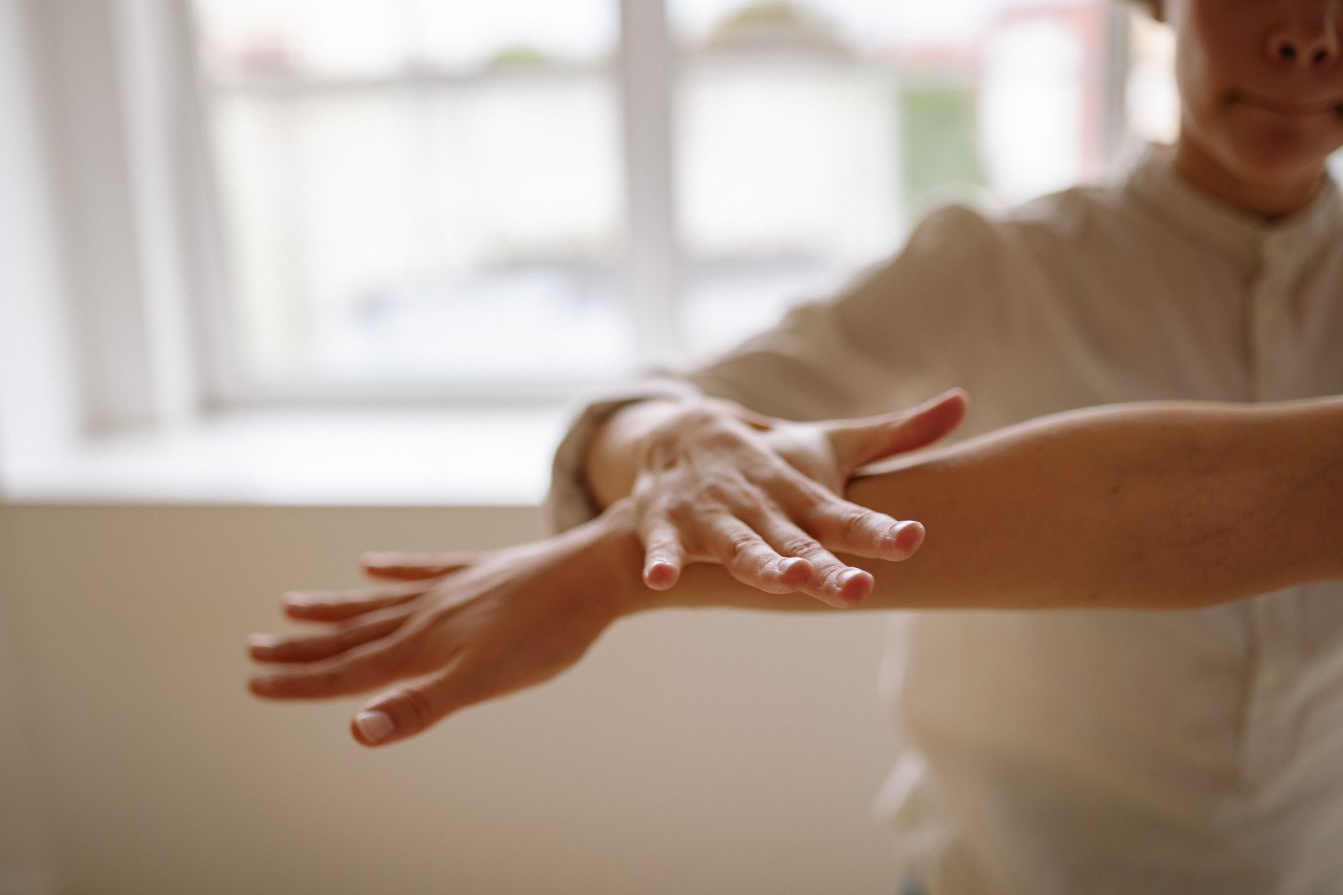 a therapist hand on the client s arm